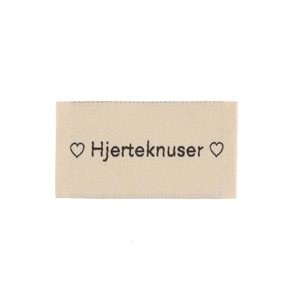 Merkelapp med tekst 25x45mm – Hjerteknuser
